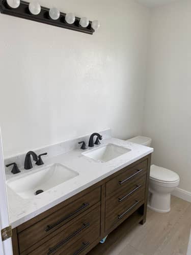 bathroom remodel vanity toilet and light fixture install